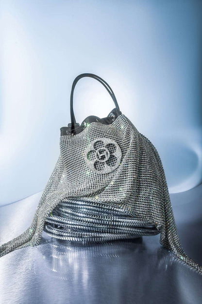 THE CRYSTAL POPPI BUCKET BAG IN STARDUST SILVER